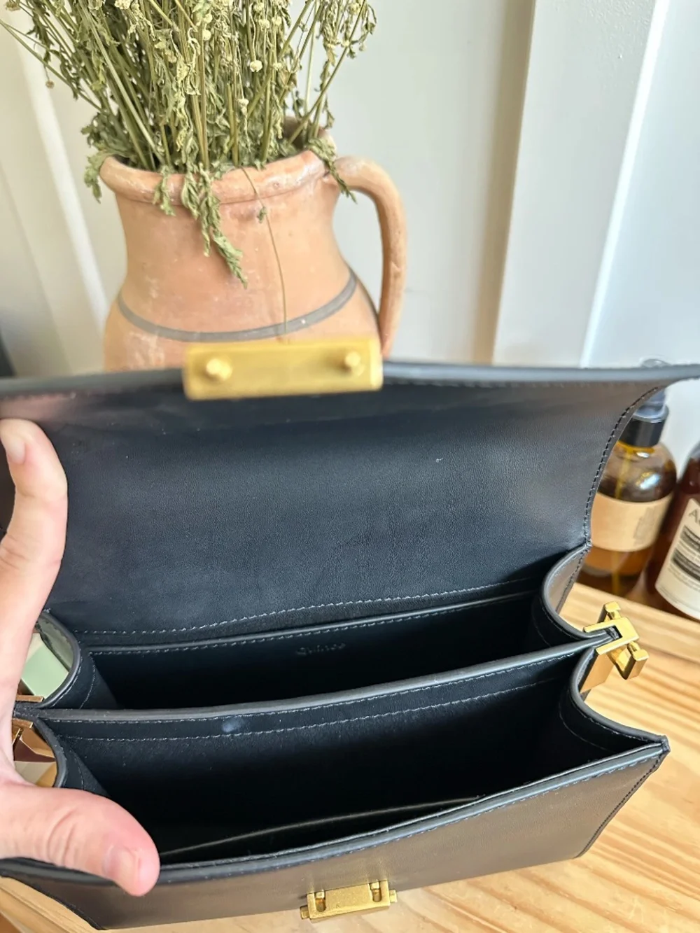 Quince black leather top-handle bag